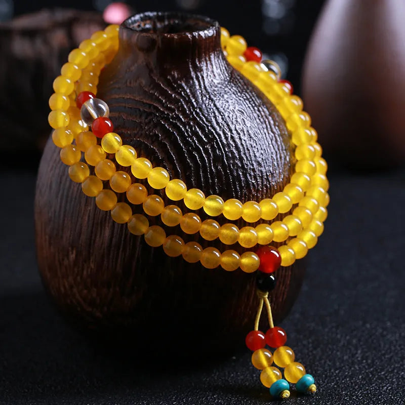 108-bead agate necklace with crystal lucky cat charm and geometric polished beads
