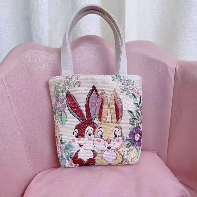 Double-sided gold wire embroidered canvas handbag in small, medium, and large sizes with patterned options.