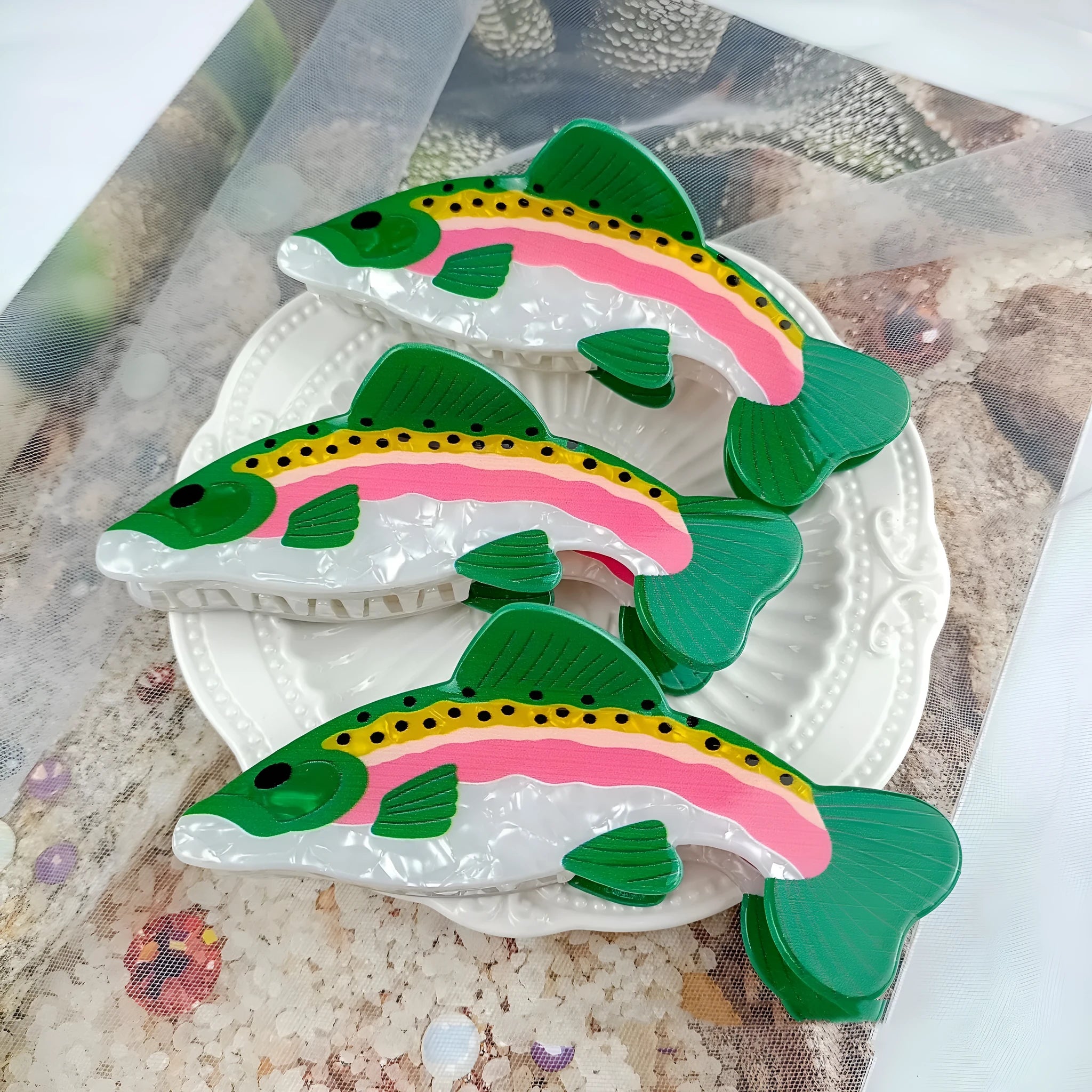 Dark green PVC hair clip with rainbow trout fish design inspired by carp elements