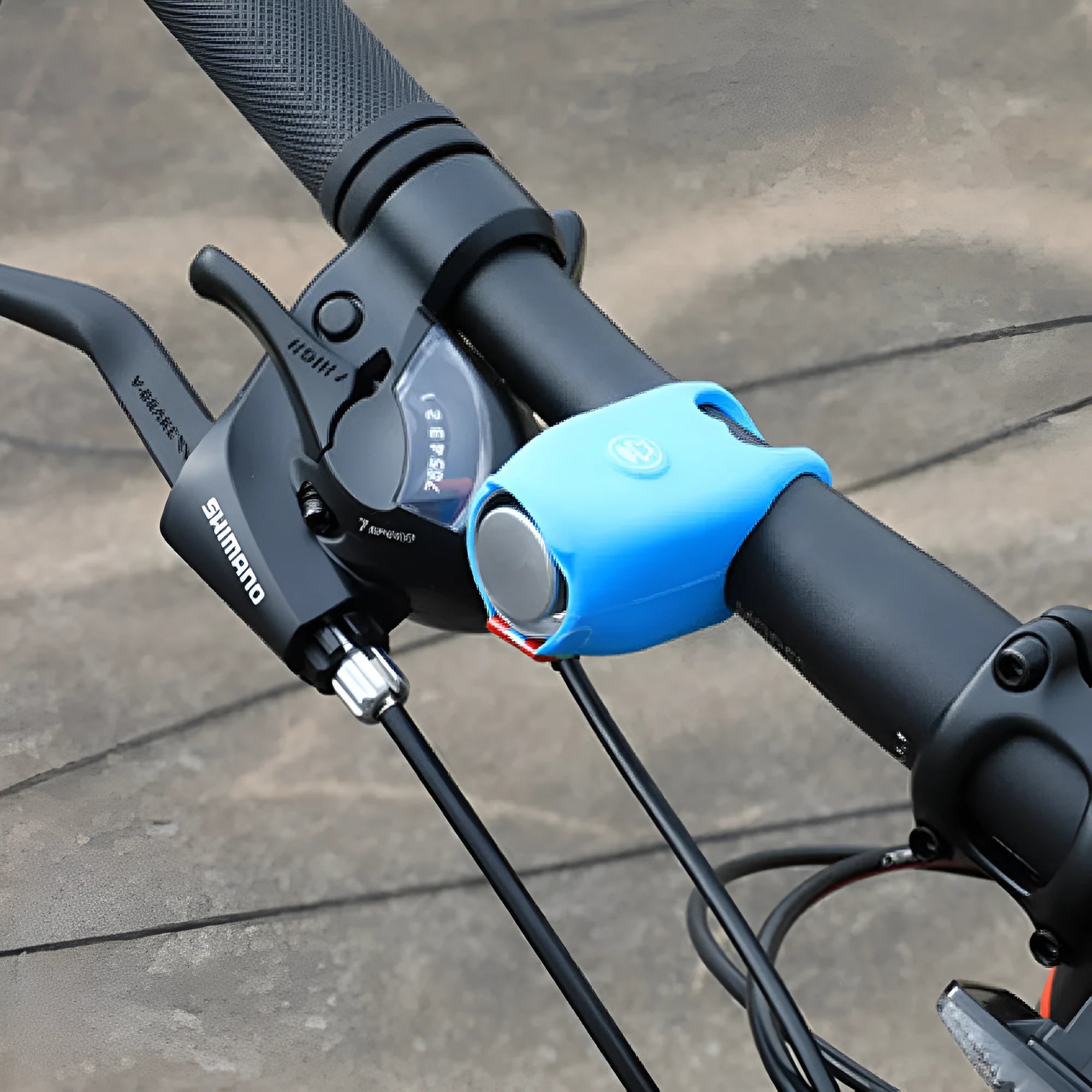 Bicycle electronic horn with plastic casing in multiple colours including black, green, purple on bicycle handlebars