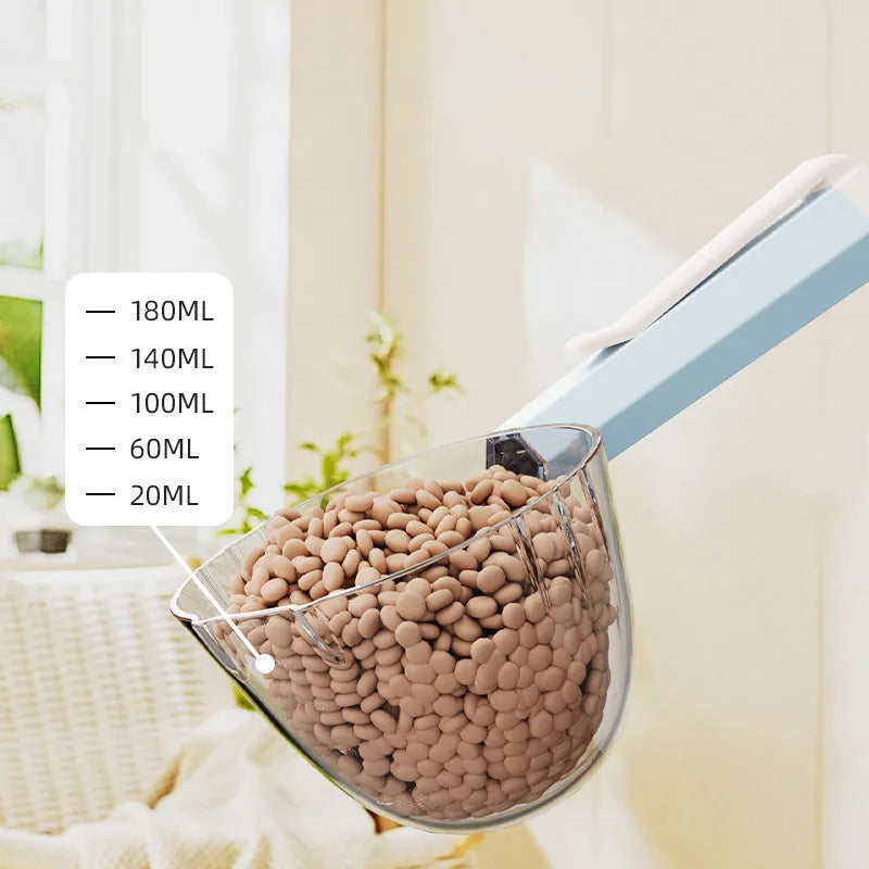 Blue pet food spoon with a metal clip attached to a dog food bag.