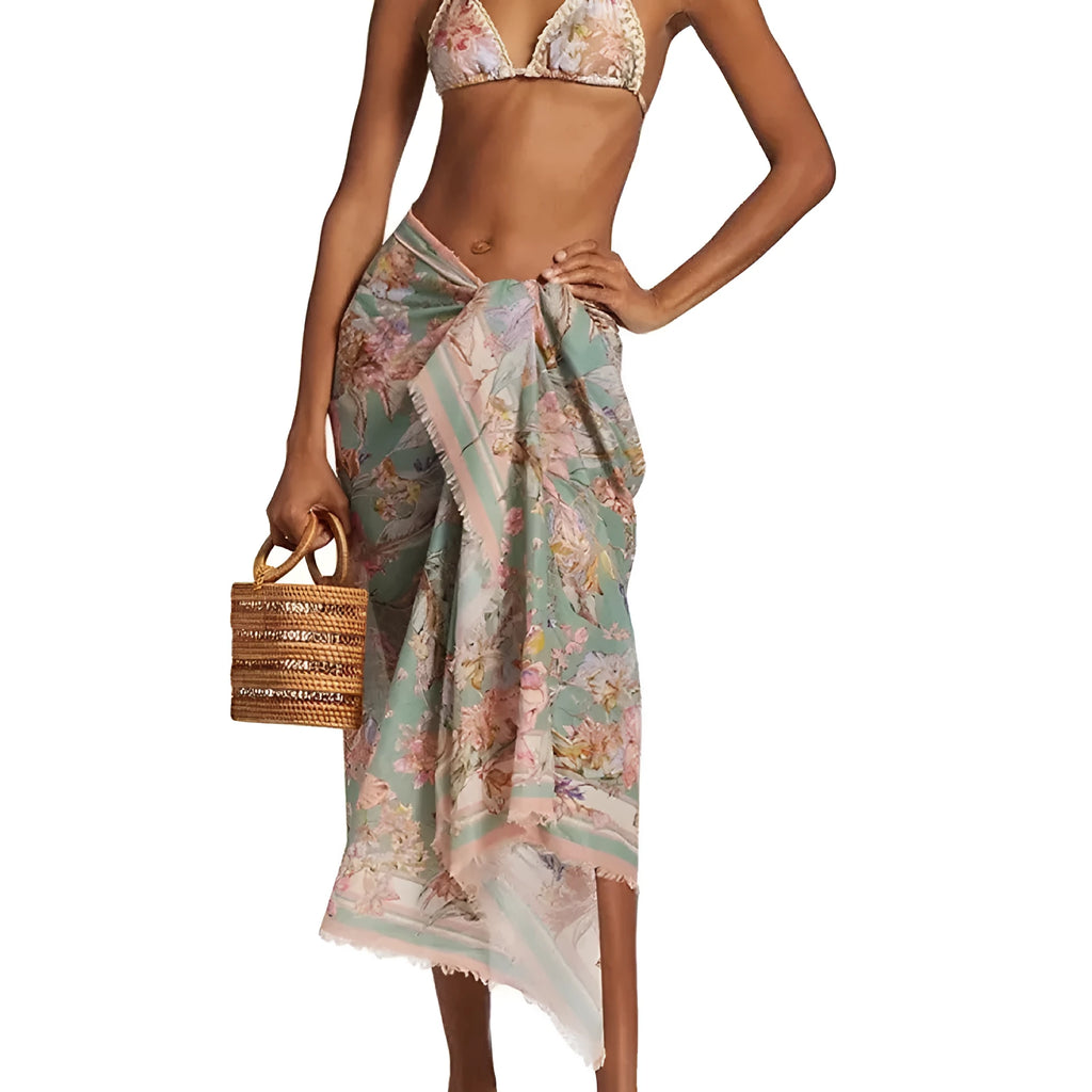 Women's creamy-white floral bikini set with matching skirt for beach holidays