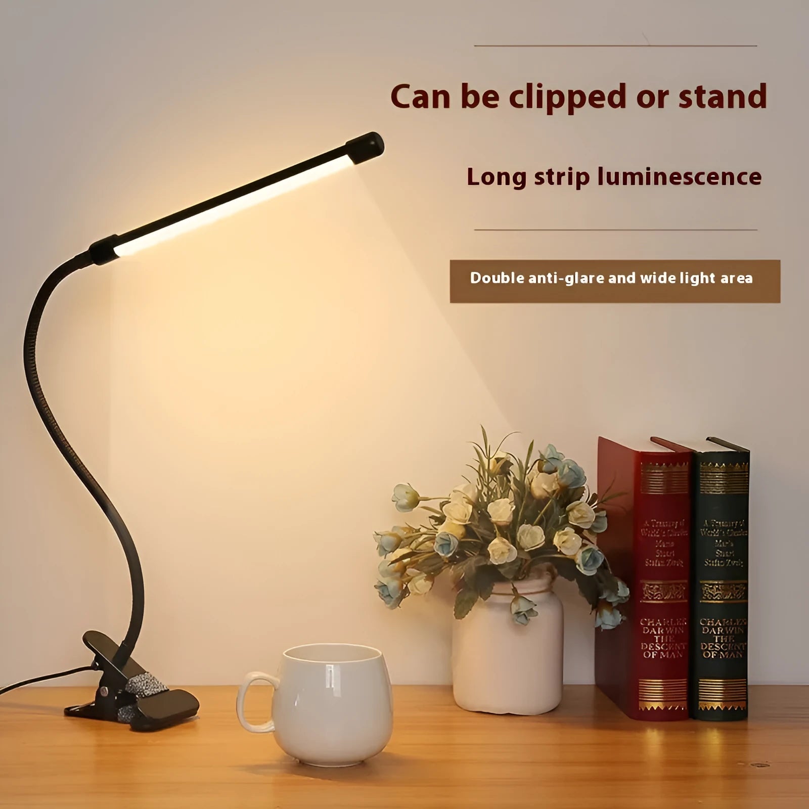 Black and white USB-powered LED desk lamp with a 26 cm length on a desk.