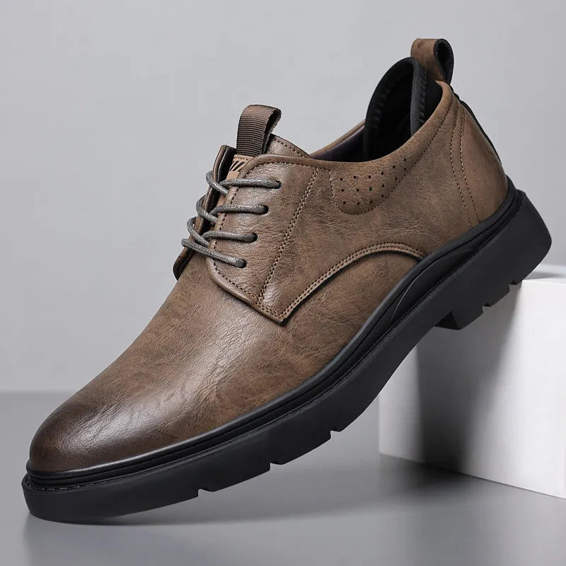 Men's black leather casual sneakers with sewing line detail on a two-layer cowhide upper and rubber sole.