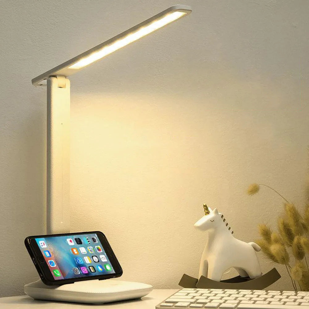 White plastic children's bedside lamp with touch dimming control and USB charging port.