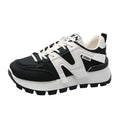 Low top running sneaker in white with round toe and lace-up front on rubber sole