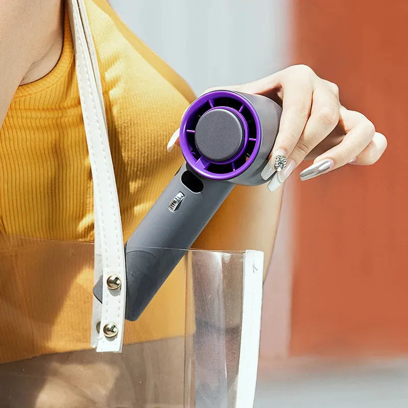 White handheld personal cooling fan showing turbine vent and adjustable controls.
