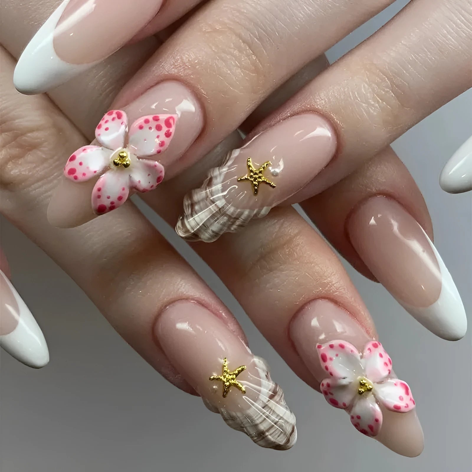 French style artificial false nails with a grey rock pattern and white flower patch design on a plastic card.