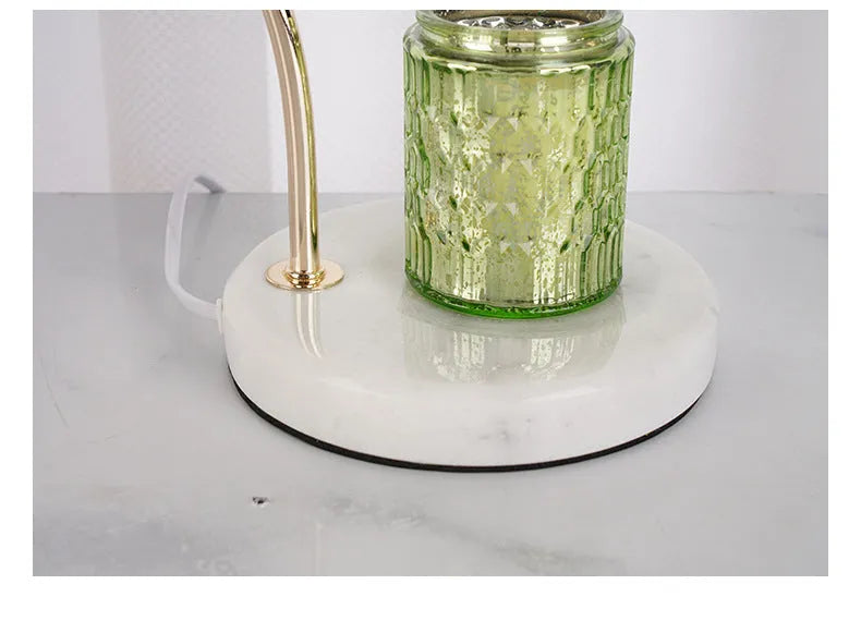 Candle light log aromatherapy table lamp with glass lampshade on nightstand, two bulbs lit, natural wood base