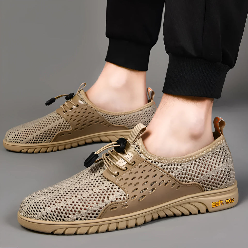 Men's breathable casual shoes in black with mesh upper, elastic band closure, and rubber sole