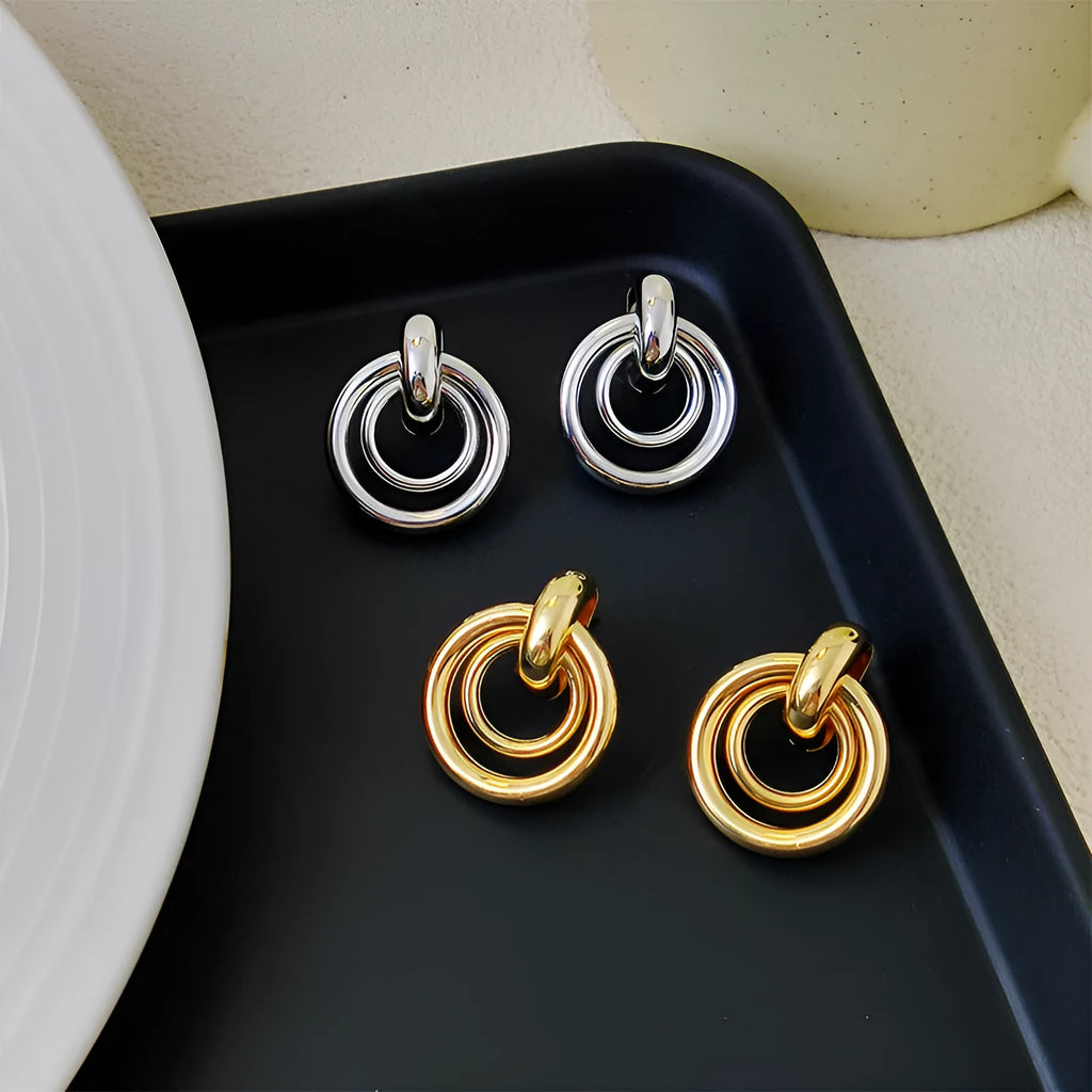 Geometric round ring earrings with irregular styling in gold and silver colour options