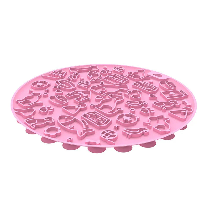 Round silicone pet licking mat with suction cups on a flat surface.