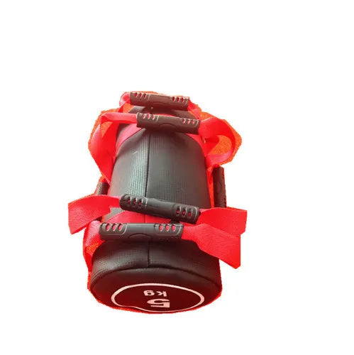 Flat white PVC fitness sandbag on gym floor, showing size and sturdy handles for weight training.