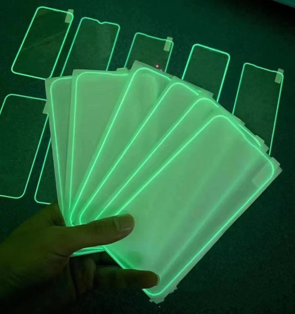 Fluorescent tempered glass screen protector for iPhone with glowing green edge on a phone