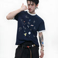 Men's blue and white loose fit short sleeve shirt with cartoon print and contrast colour details.