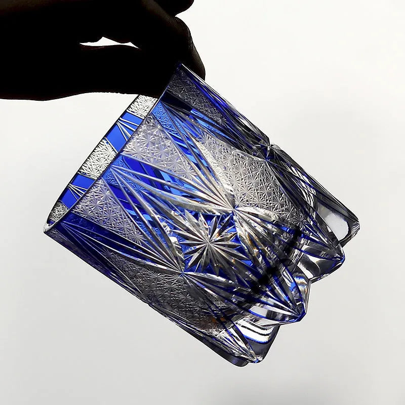 Blue hand carved crystal wine glass with 260ml capacity, retro Japanese style, on a table