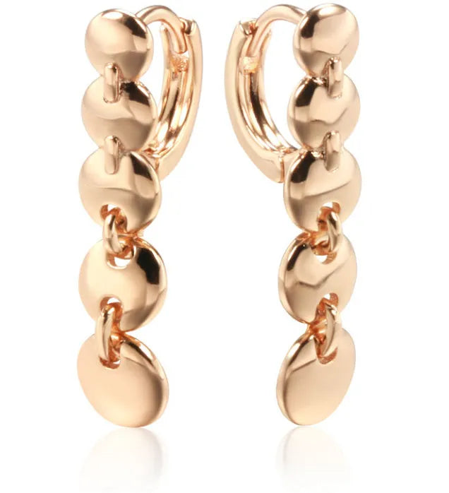 A pair of gold-coloured retro long round circle earrings with a woven copper design.