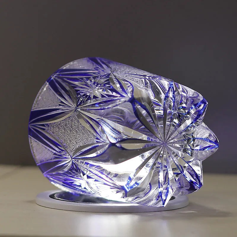 Blue hand carved crystal wine glass with 260ml capacity, retro Japanese style, on a table