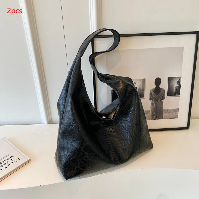 Soft leather large capacity casual shoulder bag with zip closure in multiple colour options.