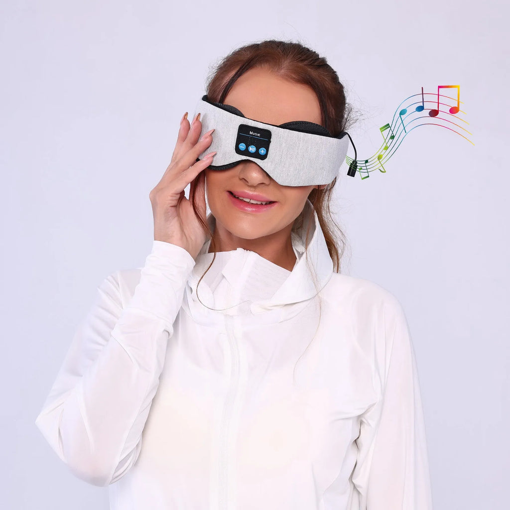 Grey outline Bluetooth sleeping eye mask with long eyelashes design on a polyester fabric.