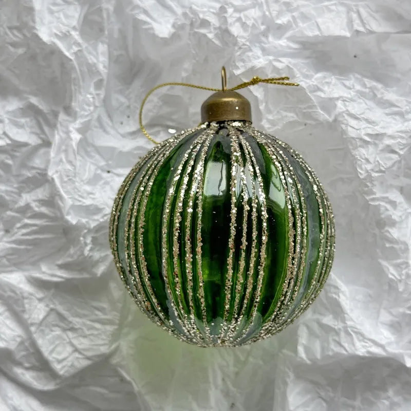Handmade glass Christmas bauble 8cm diameter in green on branch