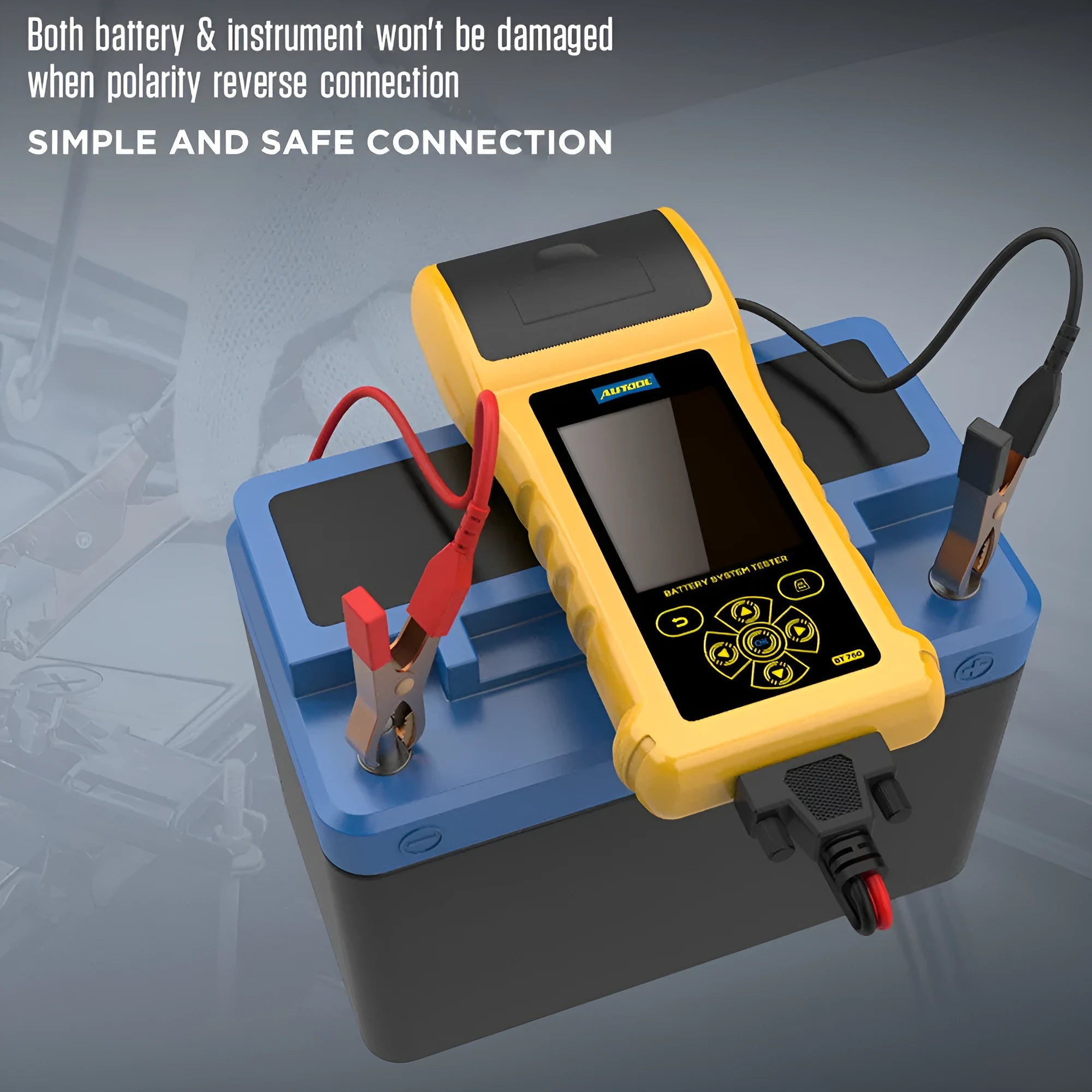 Autool BT760 vehicle battery tester with colour screen and attached battery clips on a workbench