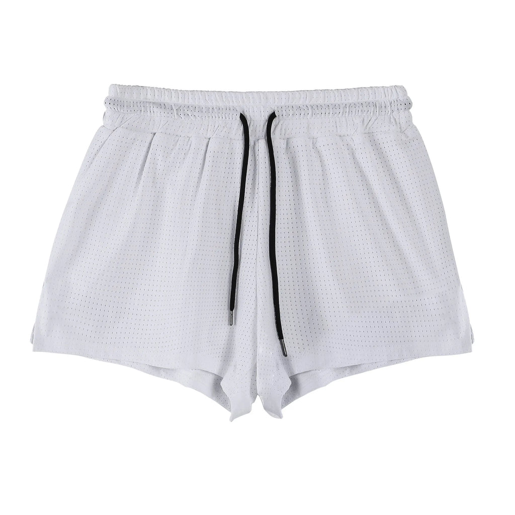 Men's black and white quick-drying nylon summer shorts laid flat, showing mid-waist and short length design.