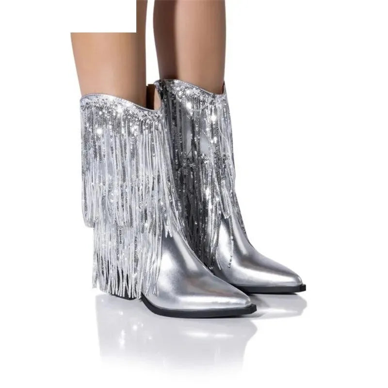Women's black chunky heel ankle boots with tassel detail and a high stiletto heel.