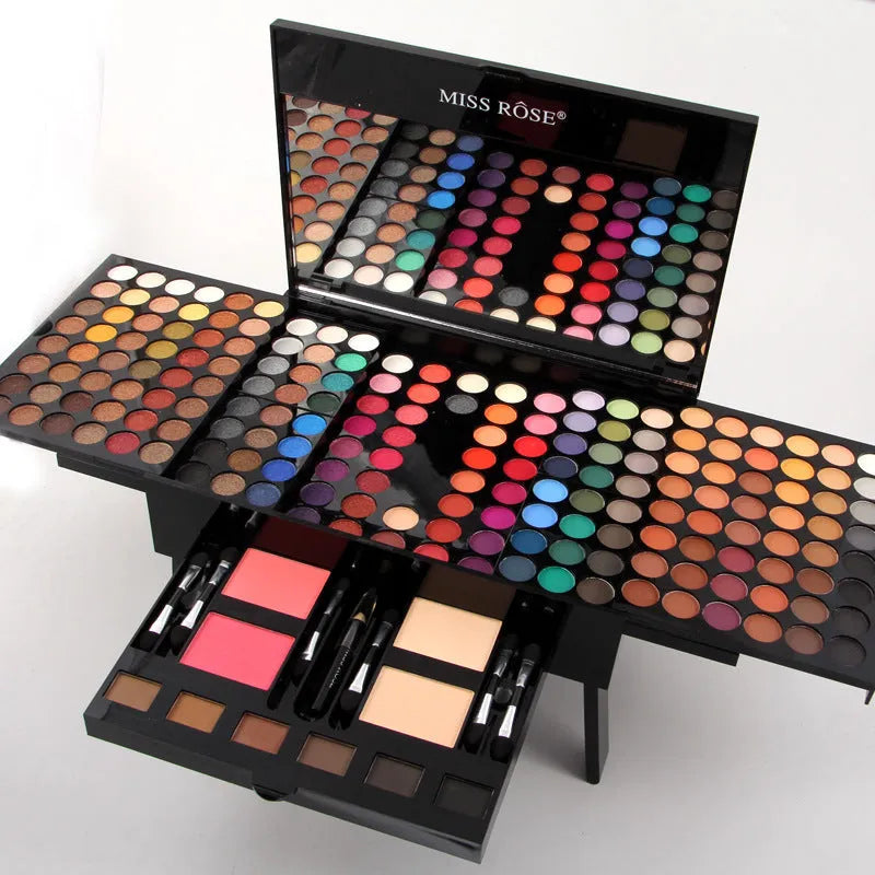 Piano keyboard-shaped makeup palette open to show 180 eyeshadows, blushers, and contour powders.