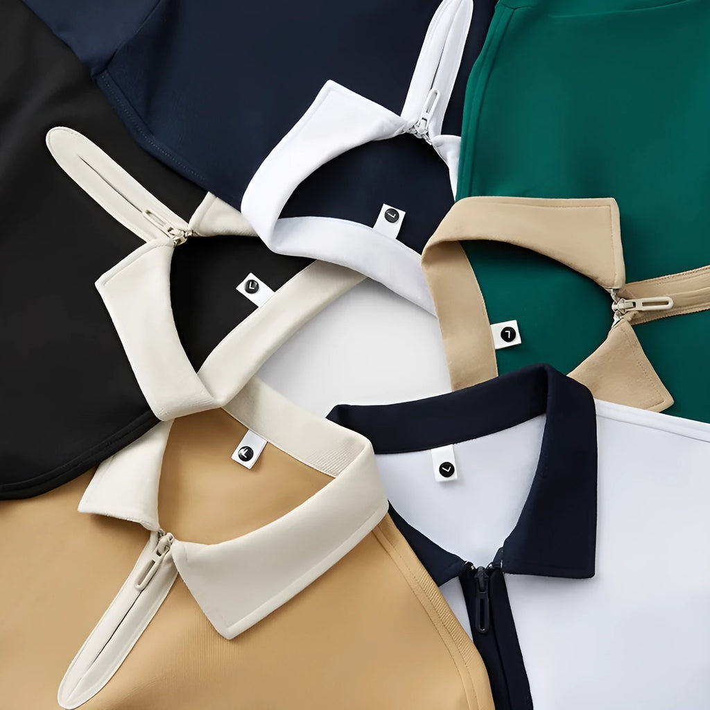 Man wearing a solid colour polo shirt with a zip-up lapel collar and short sleeves.