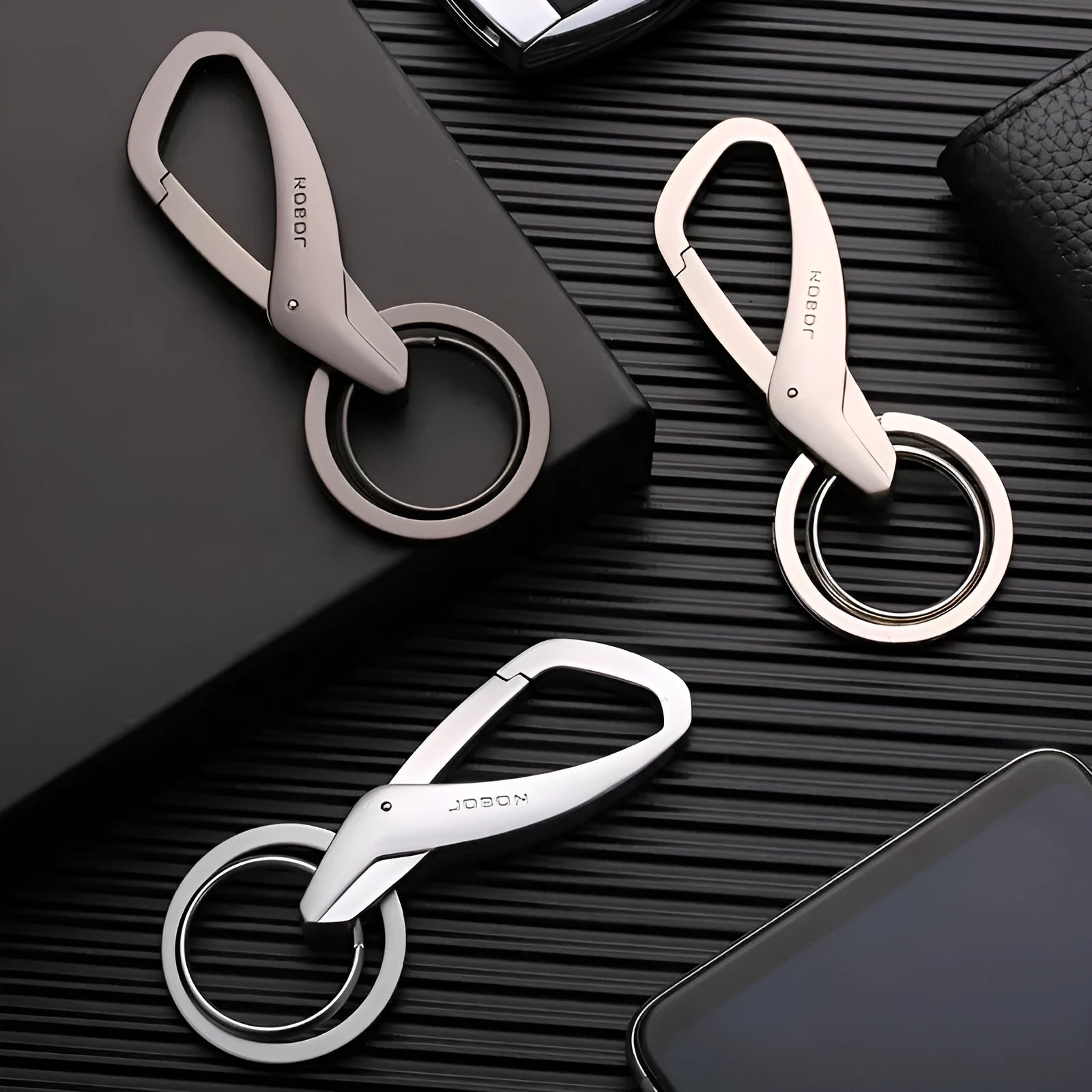 Zinc alloy car key waist hanging double ring keychain in black, chrome, or nickel colour, measuring 8.3 by 3.5 cm.