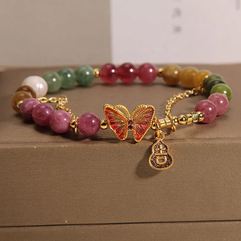 Natural jade coloured tourmaline butterfly agate bracelet for women showing pendant detail
