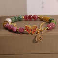 Natural jade coloured tourmaline butterfly agate bracelet for women showing pendant detail