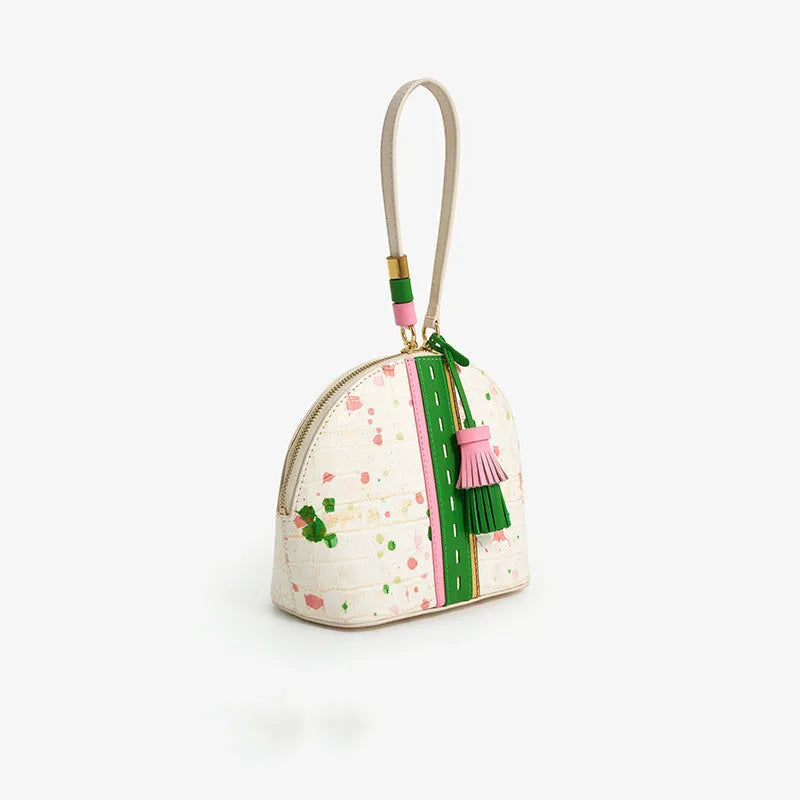 Women's genuine cow leather shell shape tassel handbag in Gypsophila colour with zipper closure