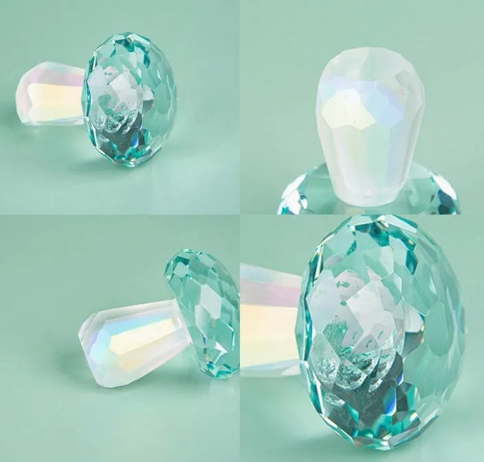 Colourful geometric crystal mushroom decoration in transparent, green, red, or yellow, 40mm by 53mm.