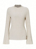 Long sleeve round neck slim fit top in black with lantern sleeves and a subtle sunken stripe pattern.