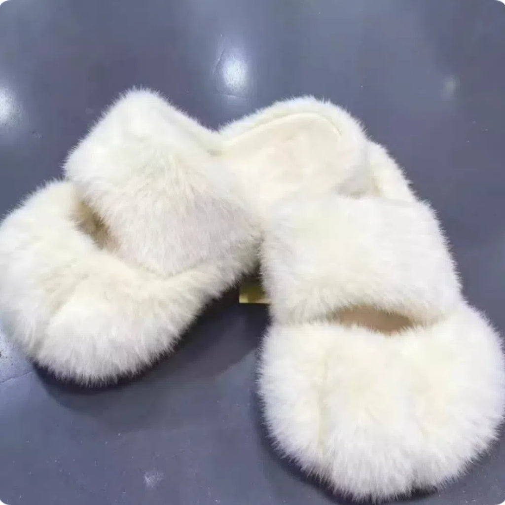 Cat paw fleece-lined slippers in yellow with non-slip sole on a floor