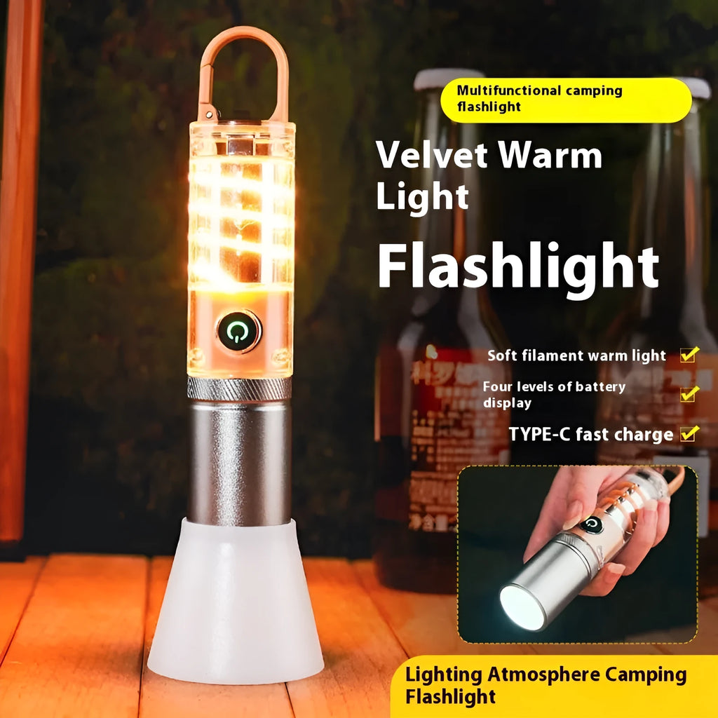 Orange 10W LED torch with optical zoom lens and keychain, shown with USB charging cable.