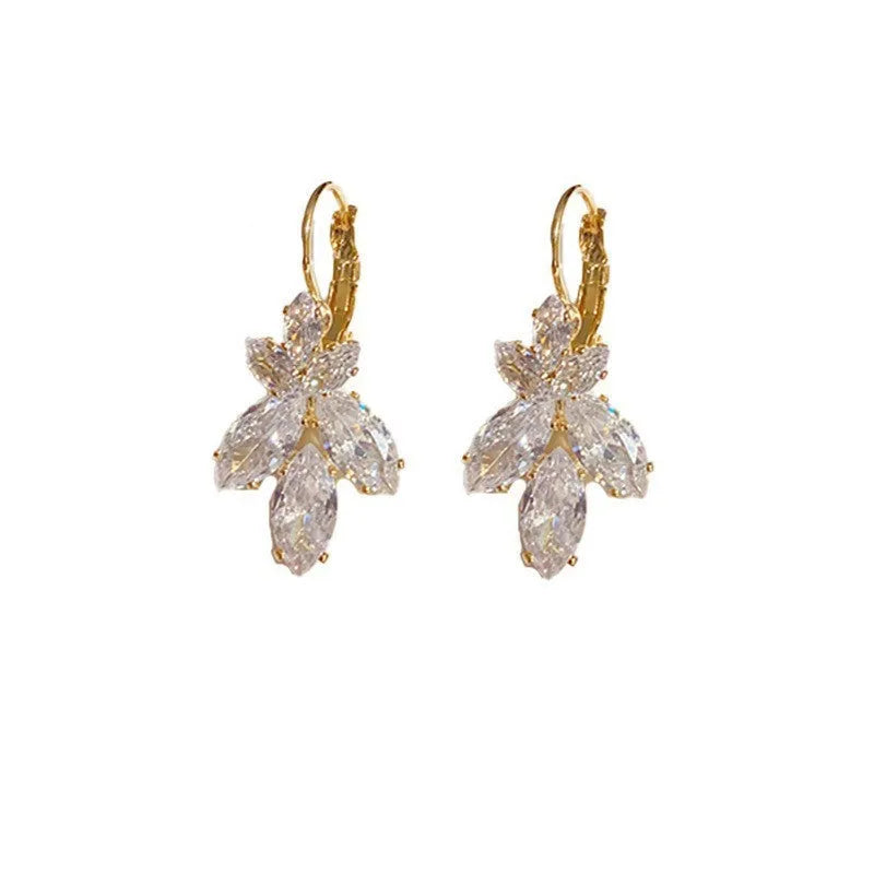Platinum colour leaf-shaped earrings with inlaid zircon stones