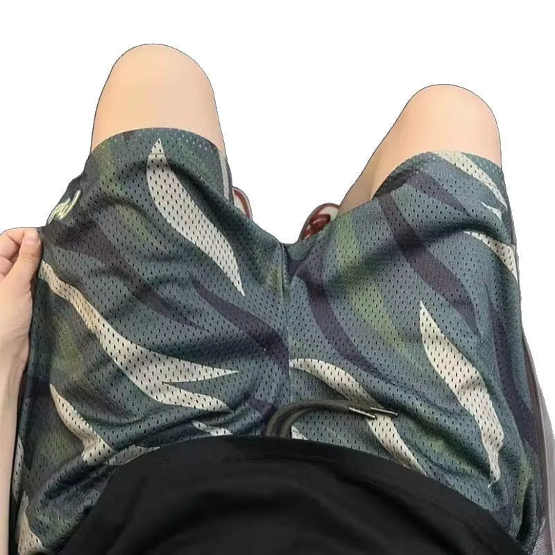 Men's straight-leg camouflage shorts in a cotton blend fabric laid flat.