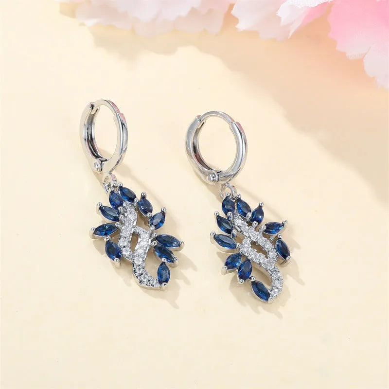 Women's sapphire blue alloy drop earrings with ethnic design elements