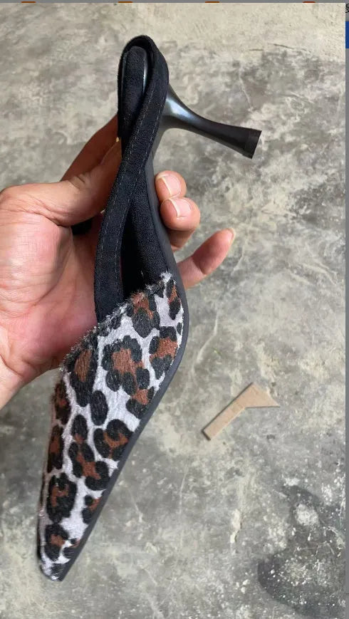 Leopard print suede women's sandals with a scattered pointed toe design on a high heel.