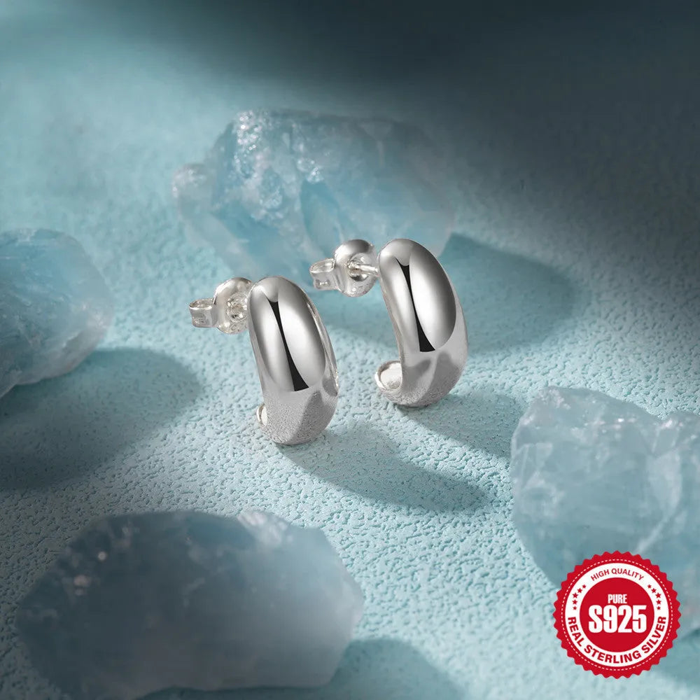 S925 sterling silver C-shaped ringstud earrings with a glossy gold electroplated finish.