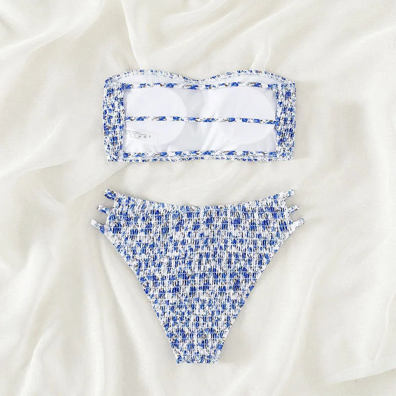 Women's strapless floral swimsuit with high-waist briefs and back split detail.