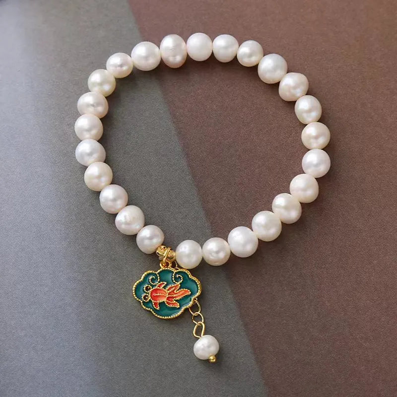 White freshwater pearl bracelet with goldfish pendant and water ripple design in vintage baroque style