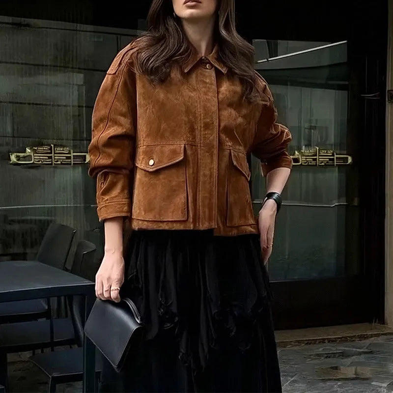 Bright brown suede-effect women's coat with regular sleeves on a hanger