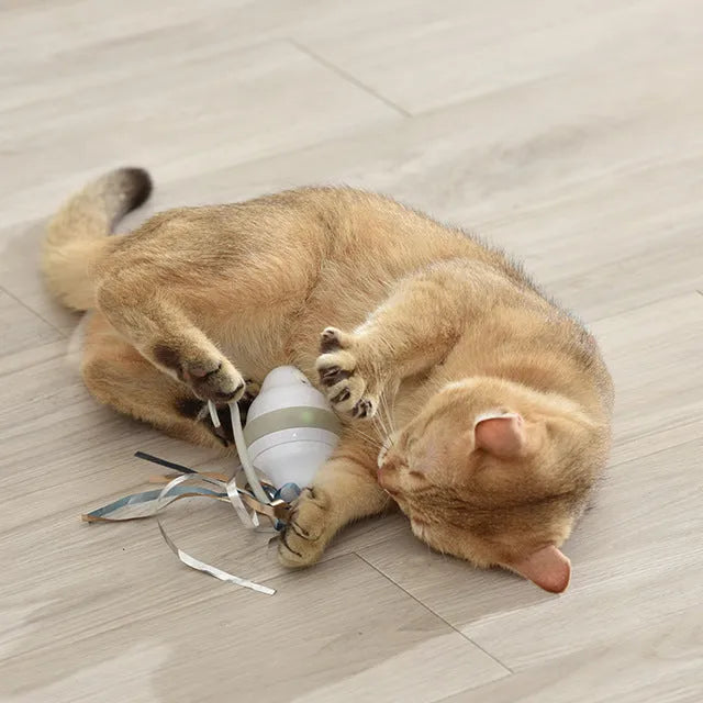 Gray 360 rolling mouse cat toy with feather teaser on plastic body, 11x8.5x6cm
