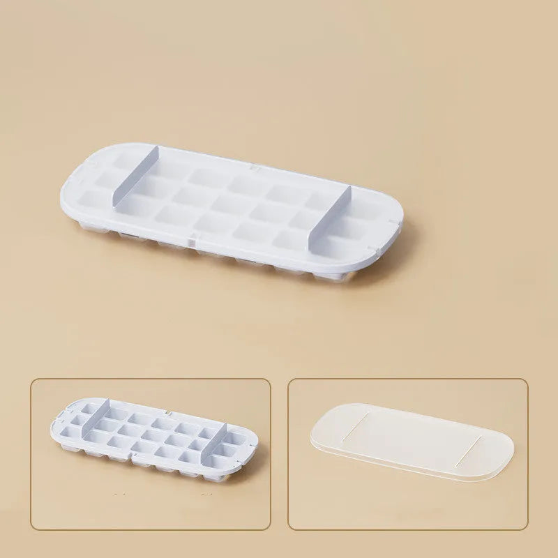 A high-capacity blue ice cube tray with a leverage-action lid and a stored ice shovel.