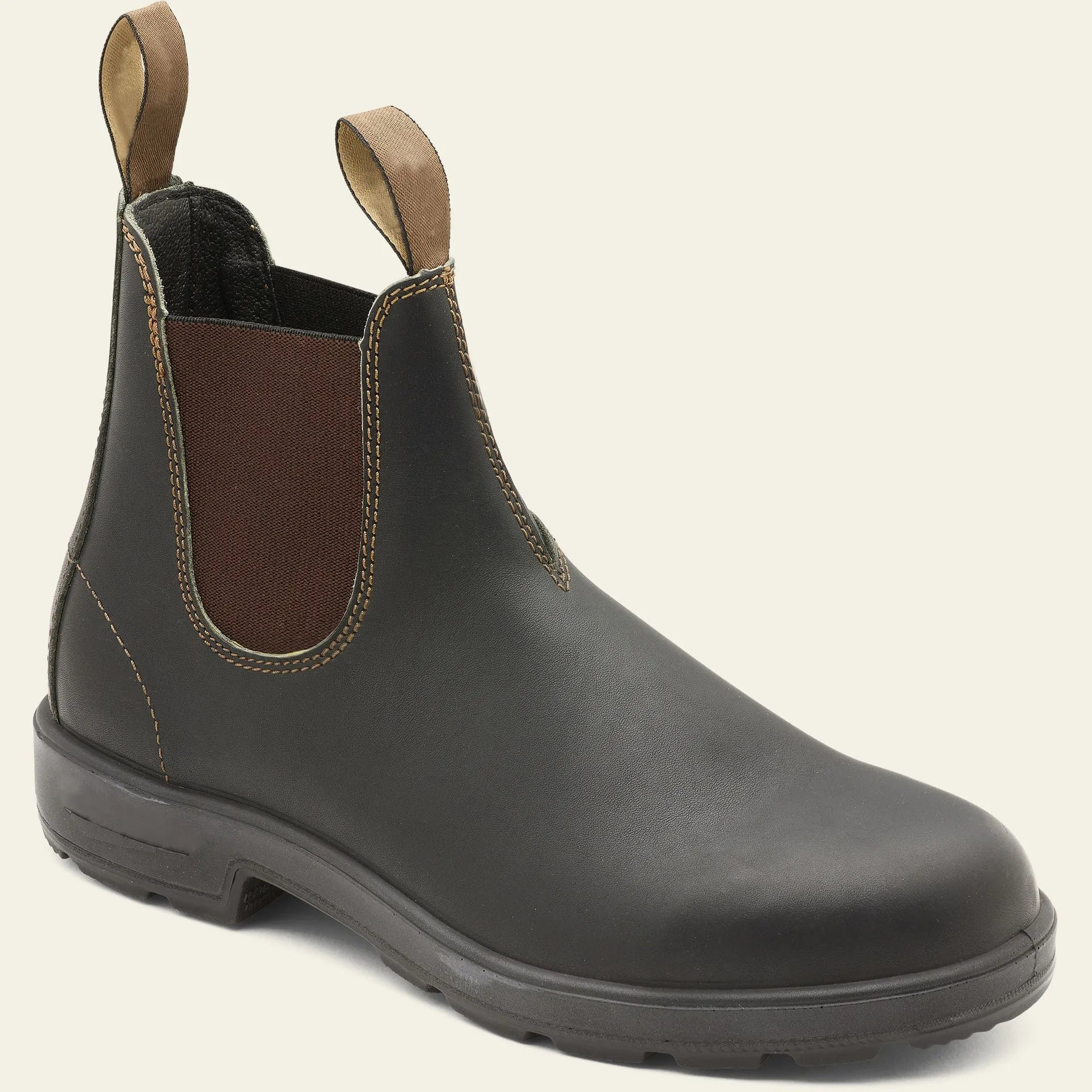 Vintage brown unisex Chelsea boots with frosted finish and a low horseshoe heel on a wooden surface.