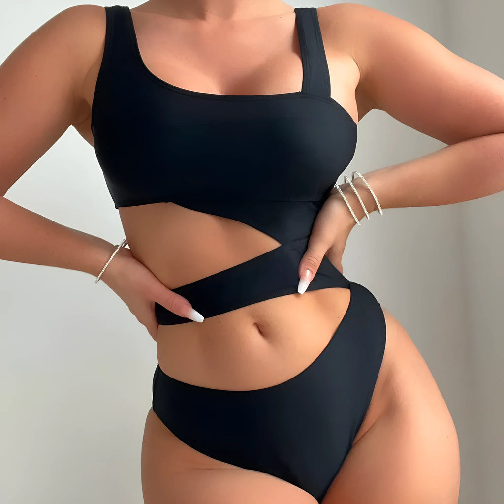 Black solid colour women's one-piece swimsuit with a high cut Siamese style and sleeveless design.